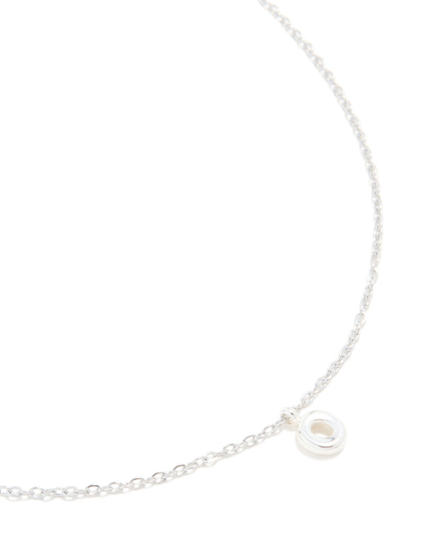 Showcasing a waterproof stainless steel mini bubble letter O necklace with initial pendant in dainty silver close up view
