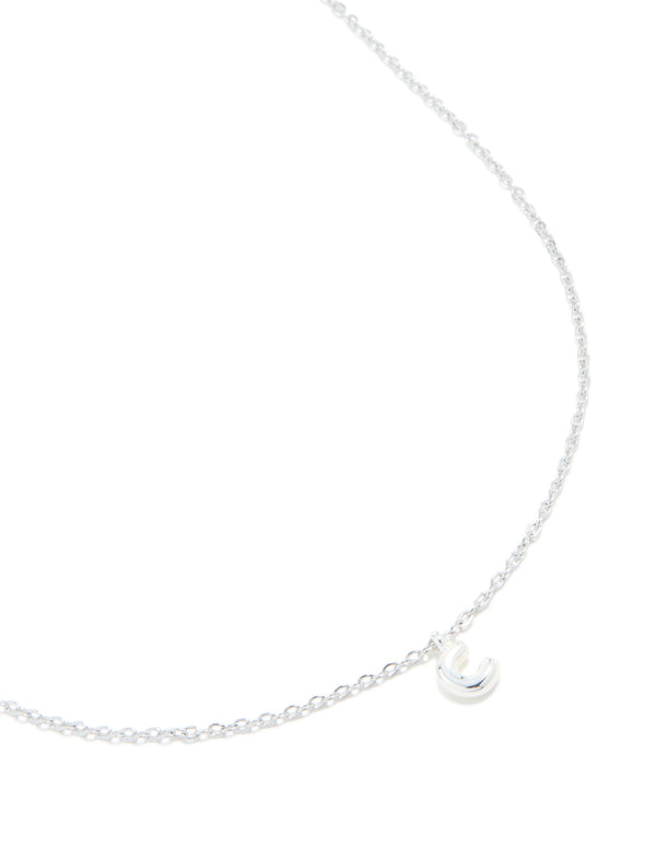 Featuring a waterproof stainless steel mini bubble letter C necklace with initial pendant in silver close up view