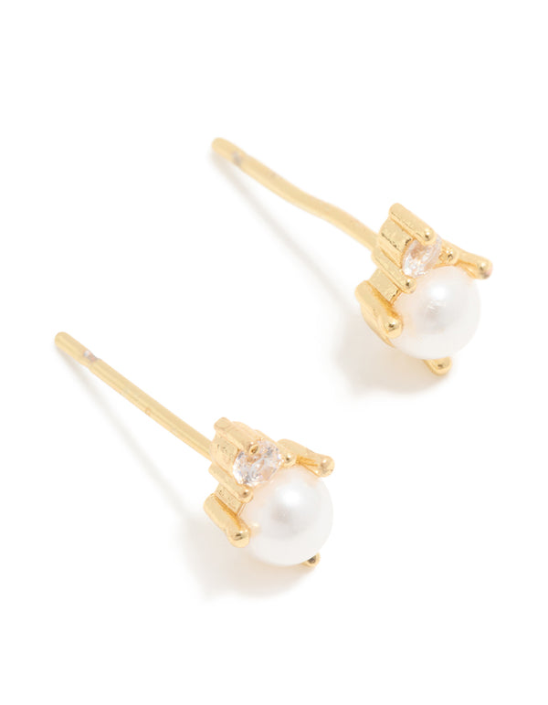 Showcasing waterproof gold plated stainless steel June cubic zirconia duo stud earrings with pearl accents front view