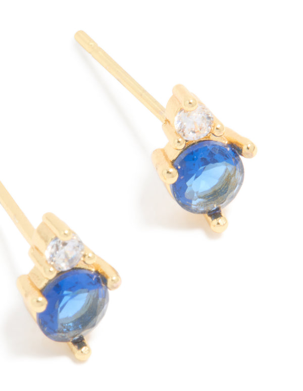 Featuring waterproof gold plated stainless steel cubic zirconia duo September birthstone stud earrings with royal blue and clear stones post detail view