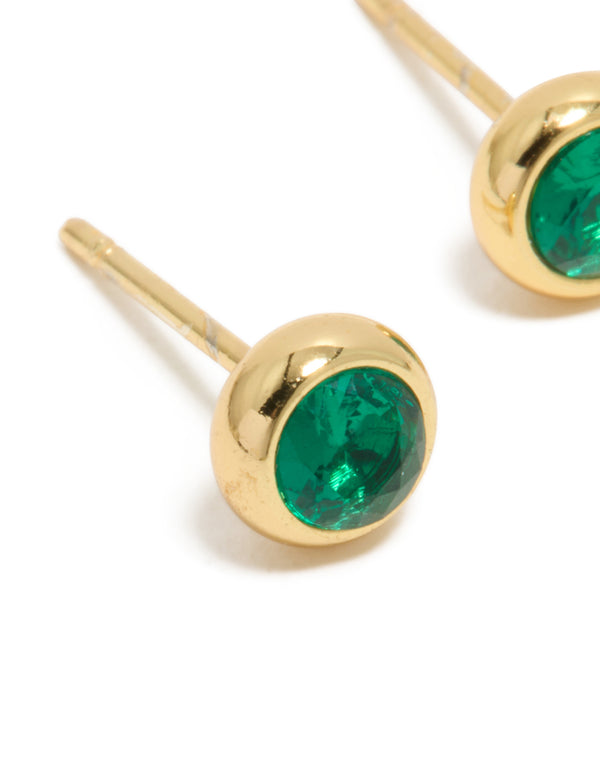 Displaying dainty waterproof stainless steel bezel stud earrings with emerald round cut cubic zirconia in gold plated teal close up view