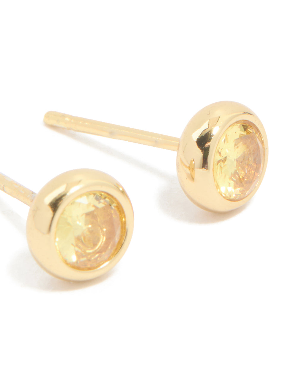 Highlighting waterproof bezel set cubic zirconia November birthstone stud earrings in gold plated stainless steel post detail view
