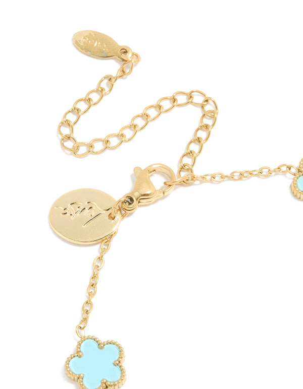 Elegantly designed waterproof gold plated stainless steel light blue petal flower charm bracelet in powder blue and gold closure detail view