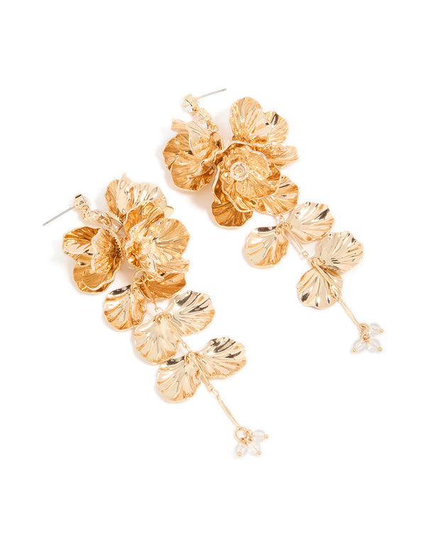 Stunning gold long floral drop earrings with leaf and beads details front view