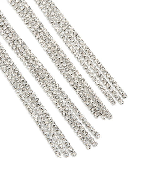Designed with diamante knot detail, these silver tassel drop statement earrings close up view