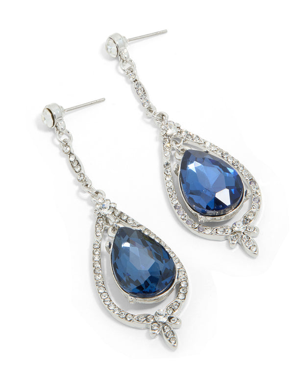 Elegant silver blue diamante pear glitzy drop earrings with statement design front view