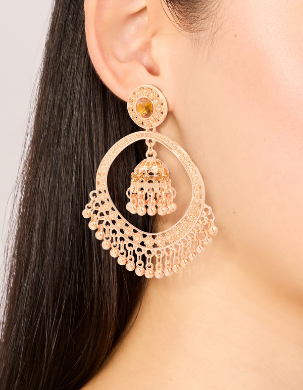 Featuring gold circle boho drop earrings with beads and charm on ear view