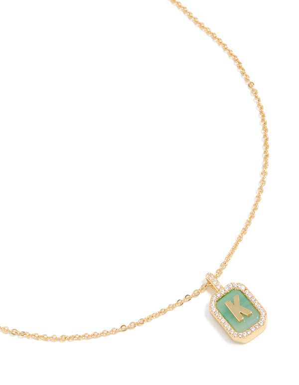 Elegant gold plated brass cubic zirconia letter K tag necklace with initials featuring pendant close up view