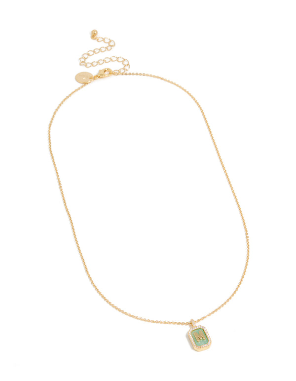 Presenting a gold plated brass cubic zirconia letter M tag necklace with initials pendant front view