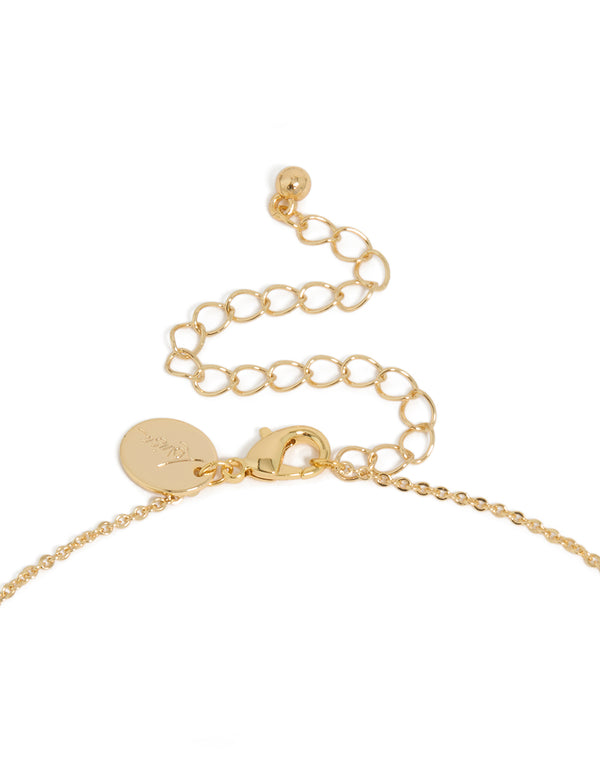 Designed with gold plated brass, cubic zirconia with letter M tag necklace featuring initials pendant with clasp detail view