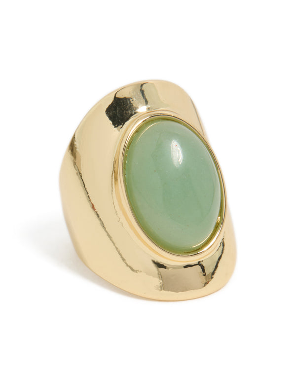 Showcasing a gold plated ring featuring an oval pale green semi precious stone side detail view