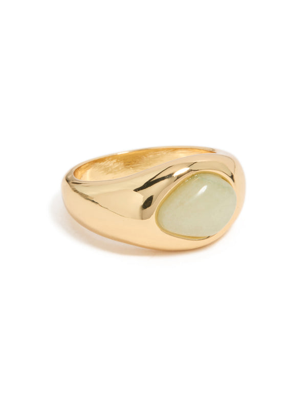 Showcasing a gold plated statement ring featuring an oval pale green stone front view