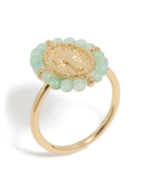 Crafted from gold plated material, this textured cross ring features beads in statement style side detail view