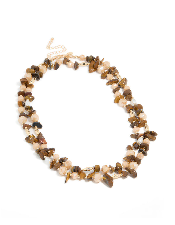 Beautifully crafted acrylic beaded and tigers eye semi precious stone boho layered necklace in brown, peachpuff, and gold front view