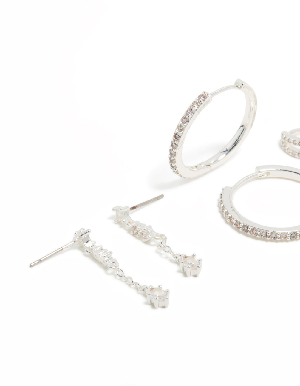 Featuring large hoop earrings with charm accents and cubic zirconia crystals on brass in a 4-pack set with multiple closure styles close up view
