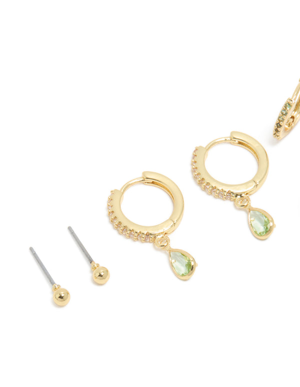 Presenting style brass peridot cubic zirconia august birthstone earrings 4-pack with huggie closure and ball studs, crafted from gold plated crystal in light green and clear close up view