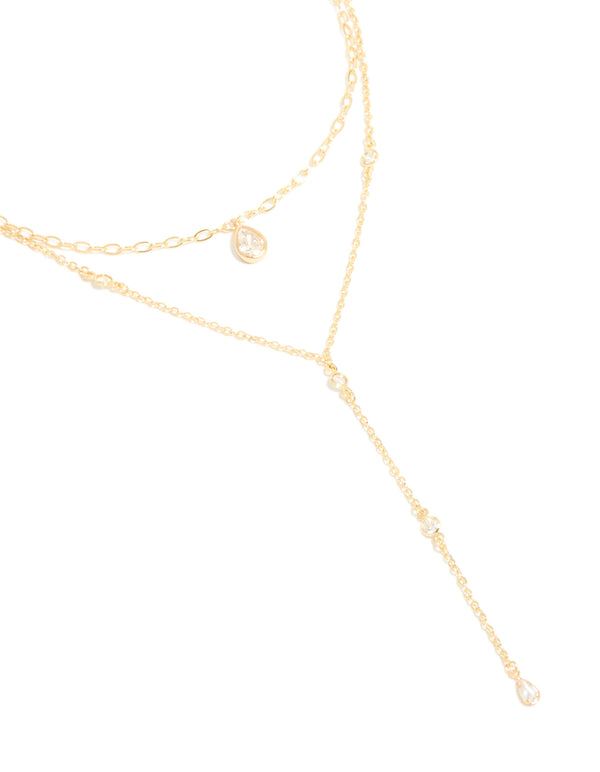 Showcasing a gold plated cubic zirconia layered Y-necklace detailing in a statement style close up view