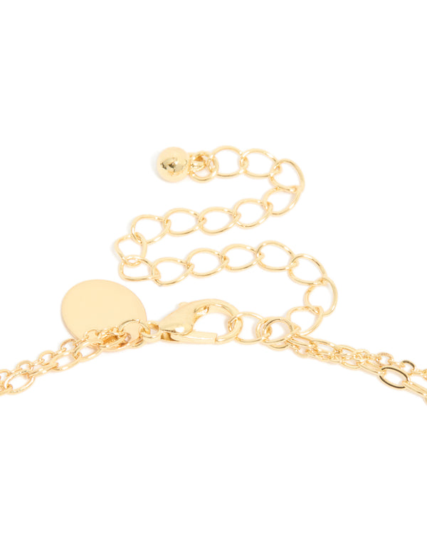 Highlighting a gold plated cubic zirconia layered Y-necklace detailing in a statement style clasp detail view
