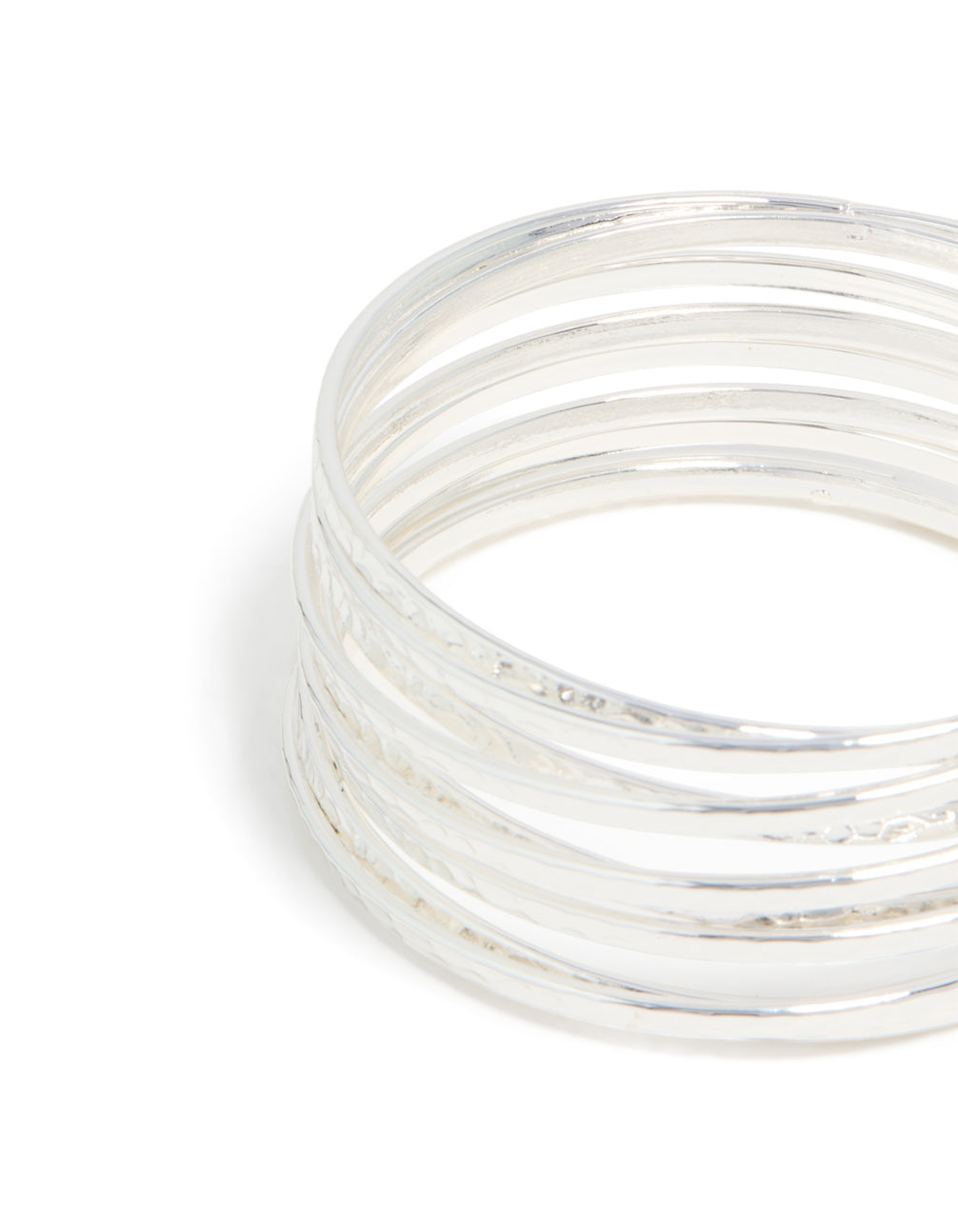 Featuring silver bangles pack with hammered and smooth textures in a close up view