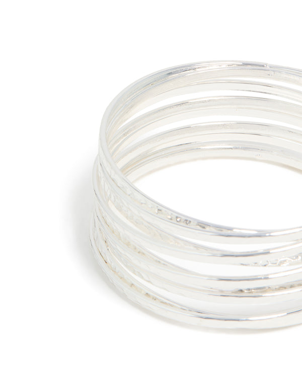 Featuring silver bangles pack with hammered and smooth textures in a close up view