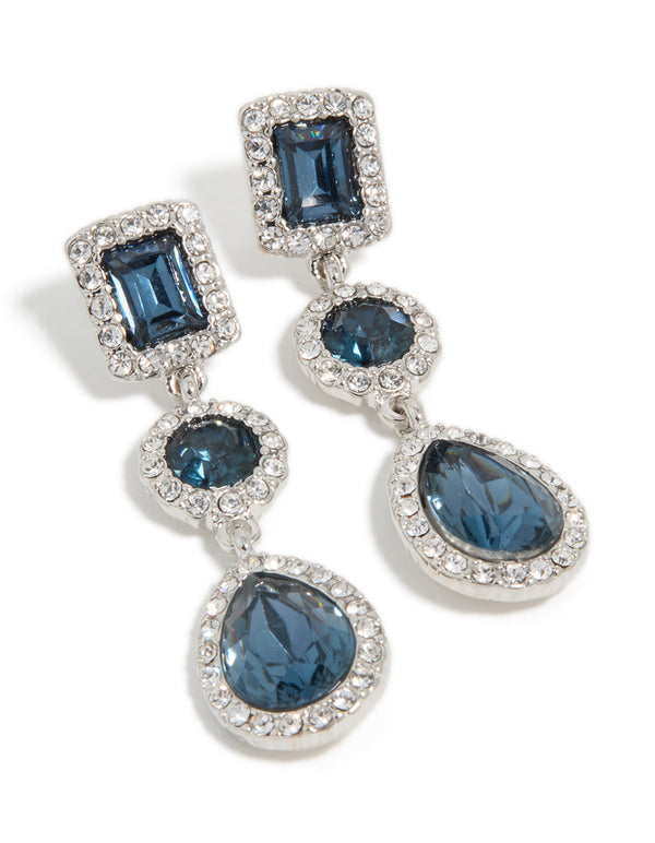 Elegant multi shape drop earrings with teal gemstones surrounded by diamante halos in silver front view