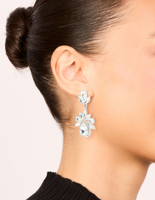 Experience elegance with silver diamante mini floral drop earrings on ear view