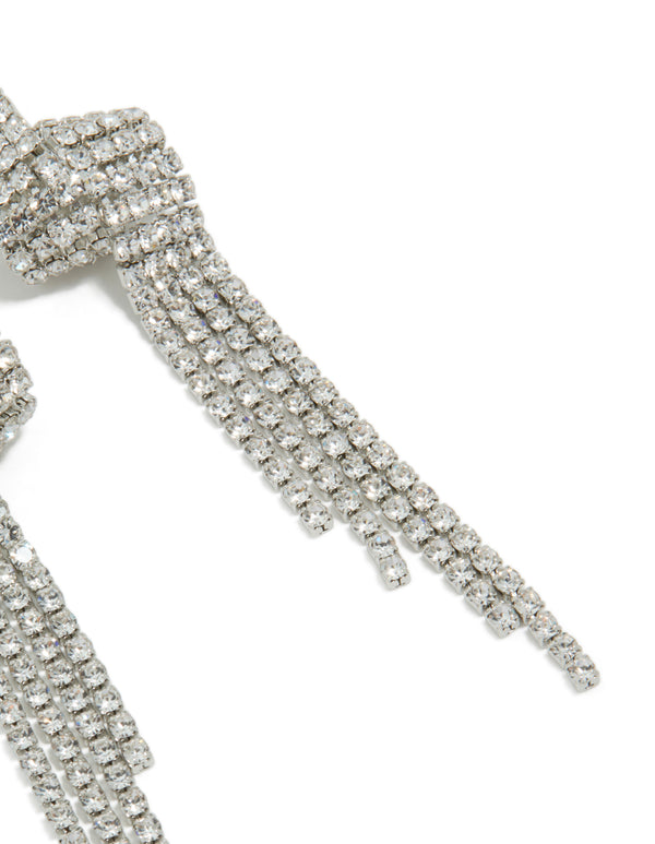 Designed with tassel statement silver diamante shiny zigzag drop earrings showcasing intricate stonework close up view
