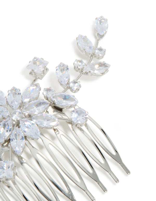 Featuring a beautiful floral pattern, this silver diamante statement hair comb is shown from the side view
