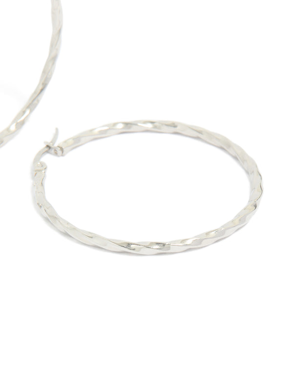 Displaying textured surgical steel hoop earrings in silver 40 MM post detail view