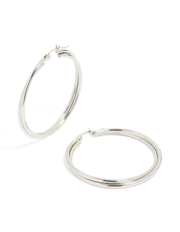 A pair of surgical steel crossover hoop earrings crafted in silver 40 MM front view