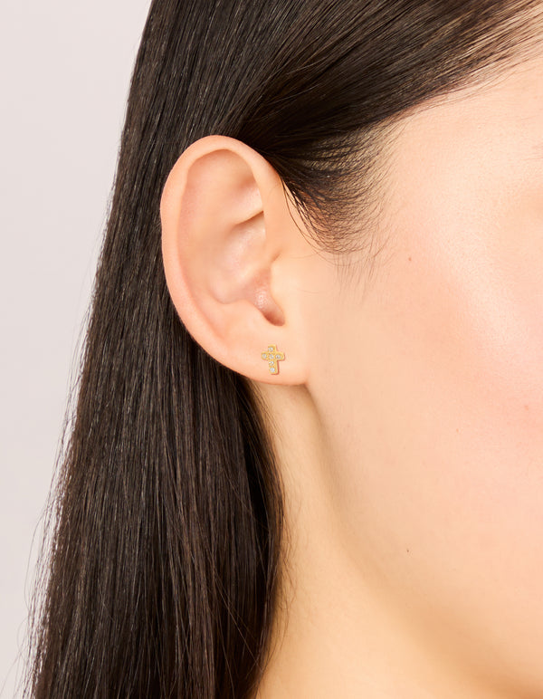 Showcasing waterproof cross stud earrings crafted from stainless steel with cubic zirconia in statement style on ear view