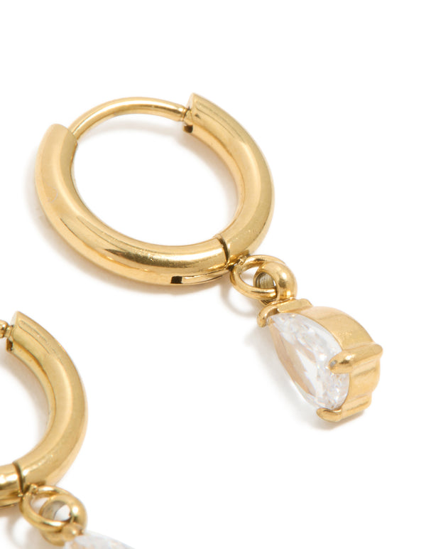 Designed with waterproof gold plated stainless steel are these dainty pear cut cubic zirconia charm huggie earrings post detail view