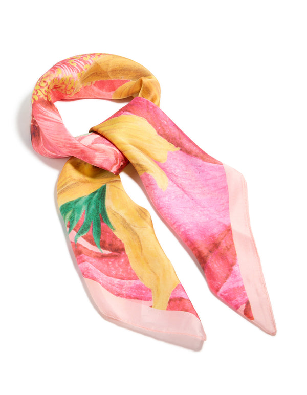 This multicoloured statement fabric flower scarf features a print in coral, gold, light pink, and green, front view