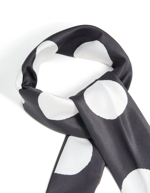 Crafted from black and white statement polka dot fabric scarf detail view