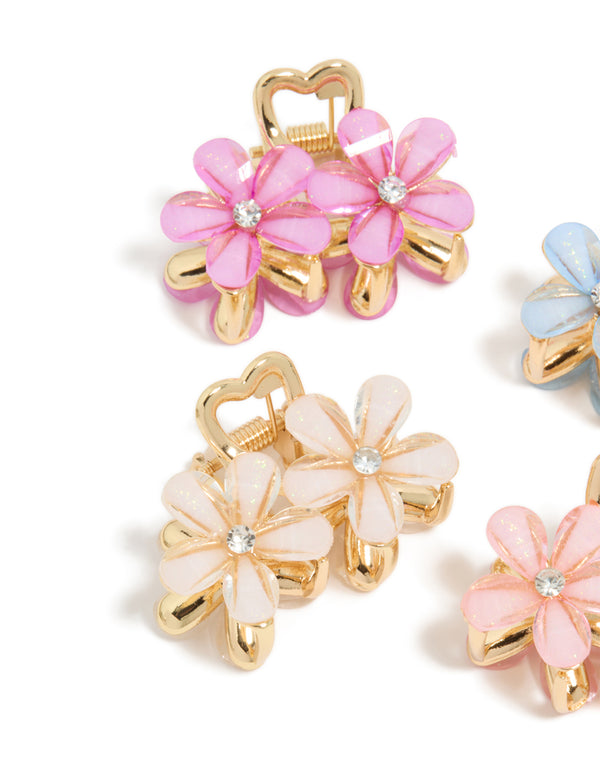 Crafted with gold double flower diamante claw clips in a 4-pack, floral pattern clasp detail view