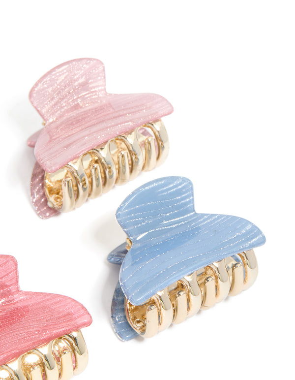 Featuring pink and blue mini claw clips 4-pack with glitter in gold finish detail view