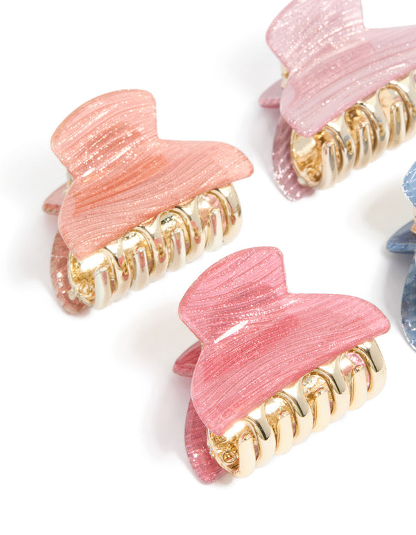 Crafted pink and blue mini claw clips 4-pack designed with glitter featuring gold finish side view