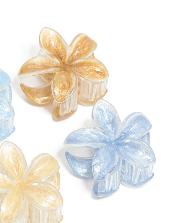Crafted with light brown and blue clear edge frangipani claw clips in a 4-pack featuring floral glitter design in tan, peachpuff, and powder colors side view