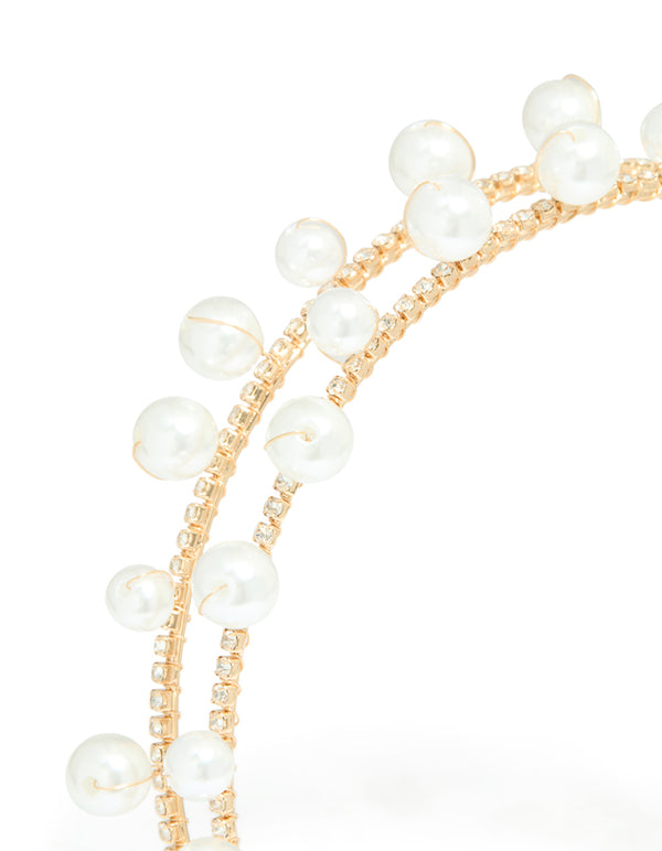 Featuring a gold scattered pearl double headband with white accents in a statement style detail view