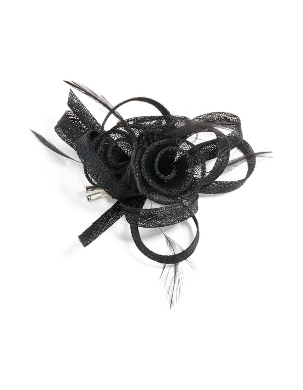 Crafted from black sinamay fabric, this floral hair clip features a swirl and feather design front view