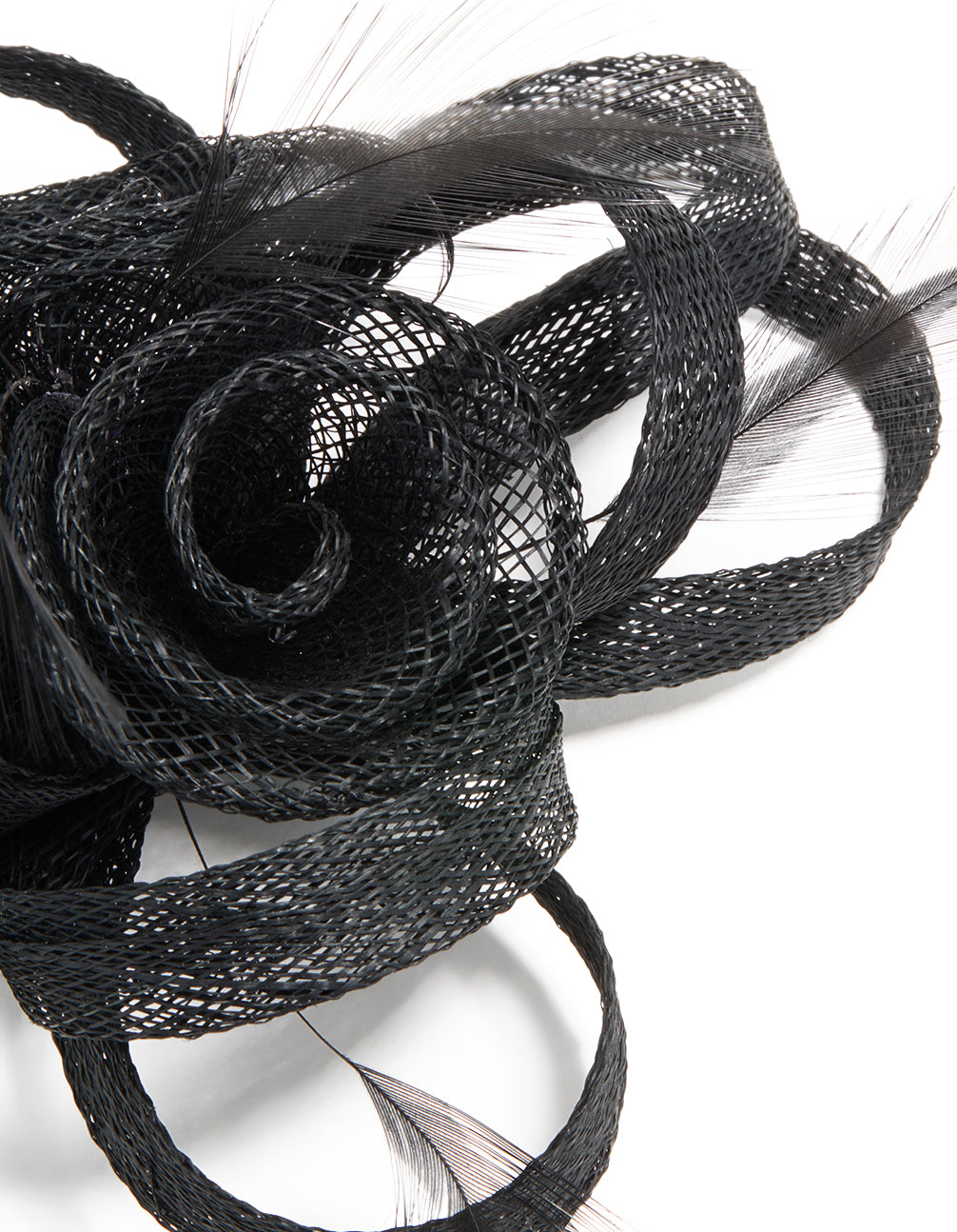 This black sinamay fabric floral hair clip features a swirl and feather design, detail view