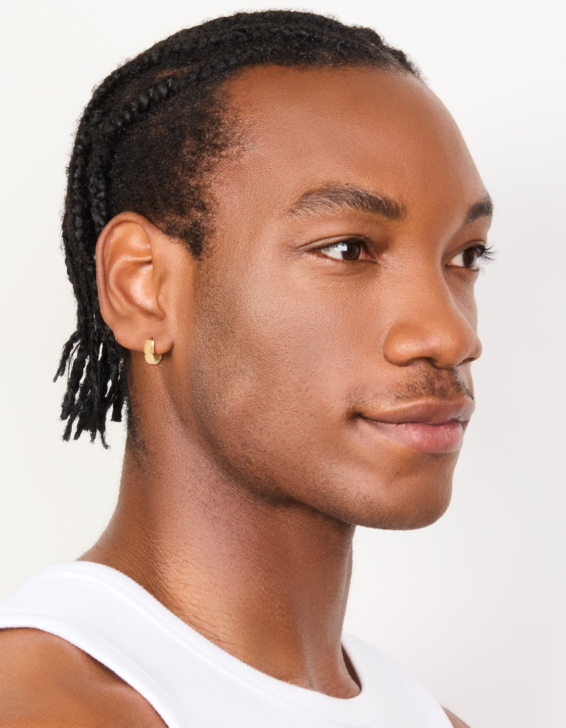 Featuring mens waterproof gold plated stainless steel brushed huggie earrings on model view