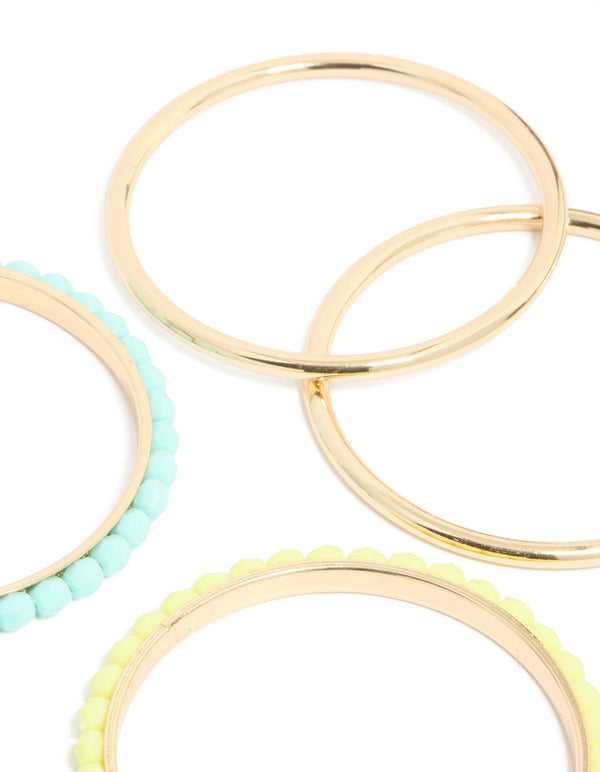 Featuring beaded acrylic bangles in gold, blue and yellow 6-pack in close up view