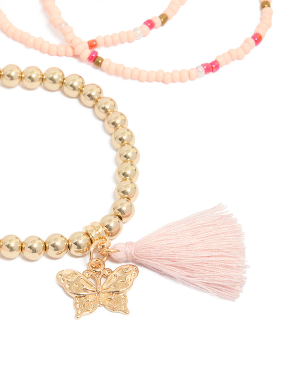 Crafted with beaded design featuring butterfly and a tassel in gold and pink close up view