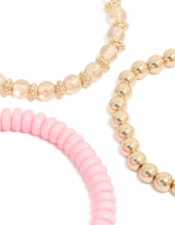 Crafted with beaded design featuring butterfly and a tassel in gold and pink close up view