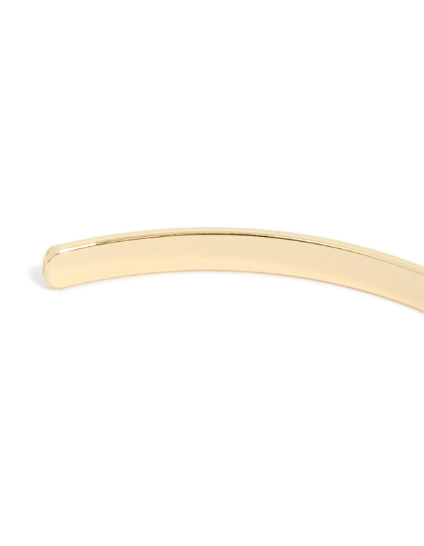This gold arm cuff features a smooth polished finish with minimalist design in closure detail view