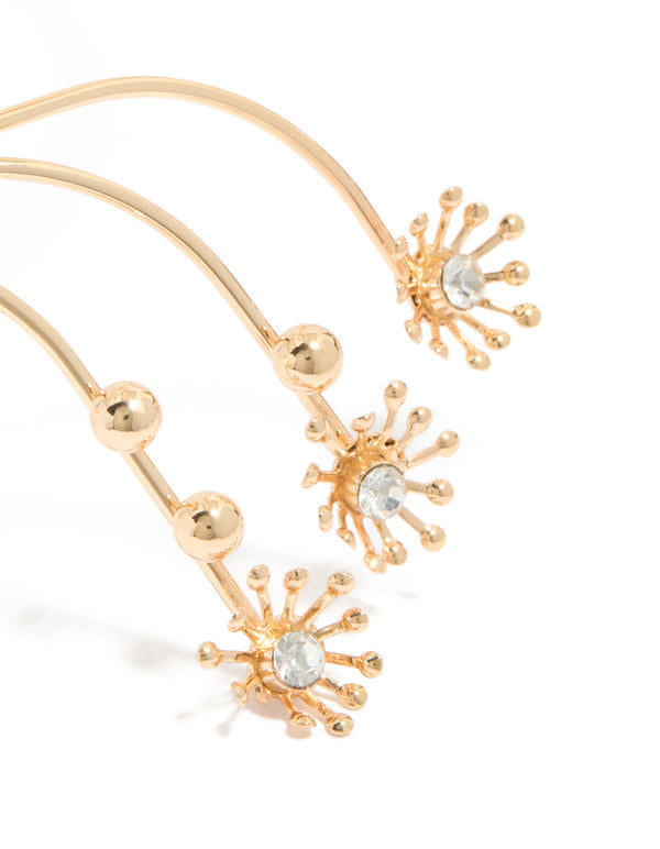 Showcasing diamante small flowers arm cuff in gold with ball feature close up view