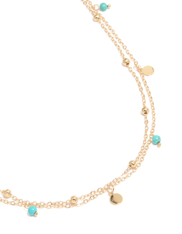 Beautifully designed waist chain with turquoise beads, gold ball, charms and embellished layered detail view