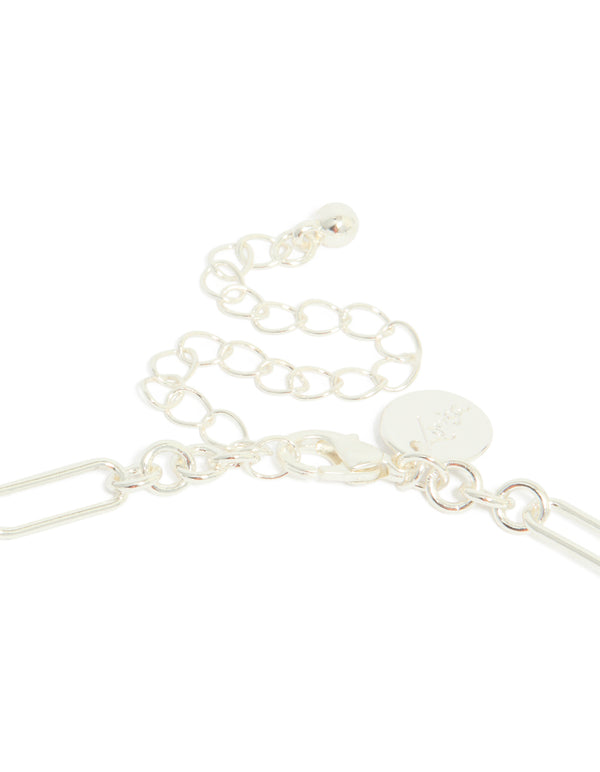 Highlighting the silver plated long figaro chain necklace with adjustable extender clasp detail view