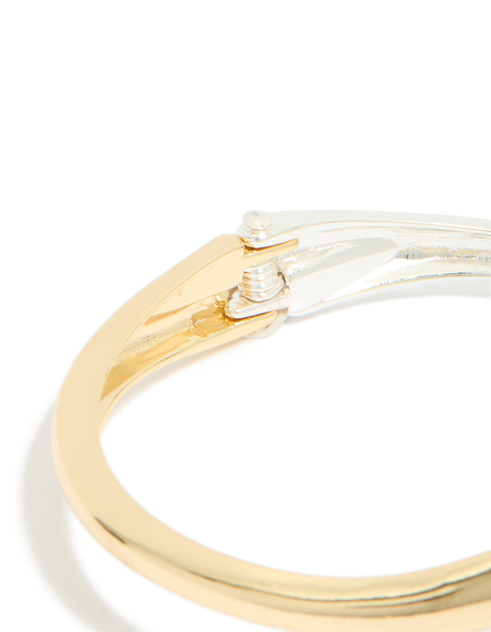 Designed with mixed metal plating in gold and silver, this wrap around bangle highlights hinged in closure detail view